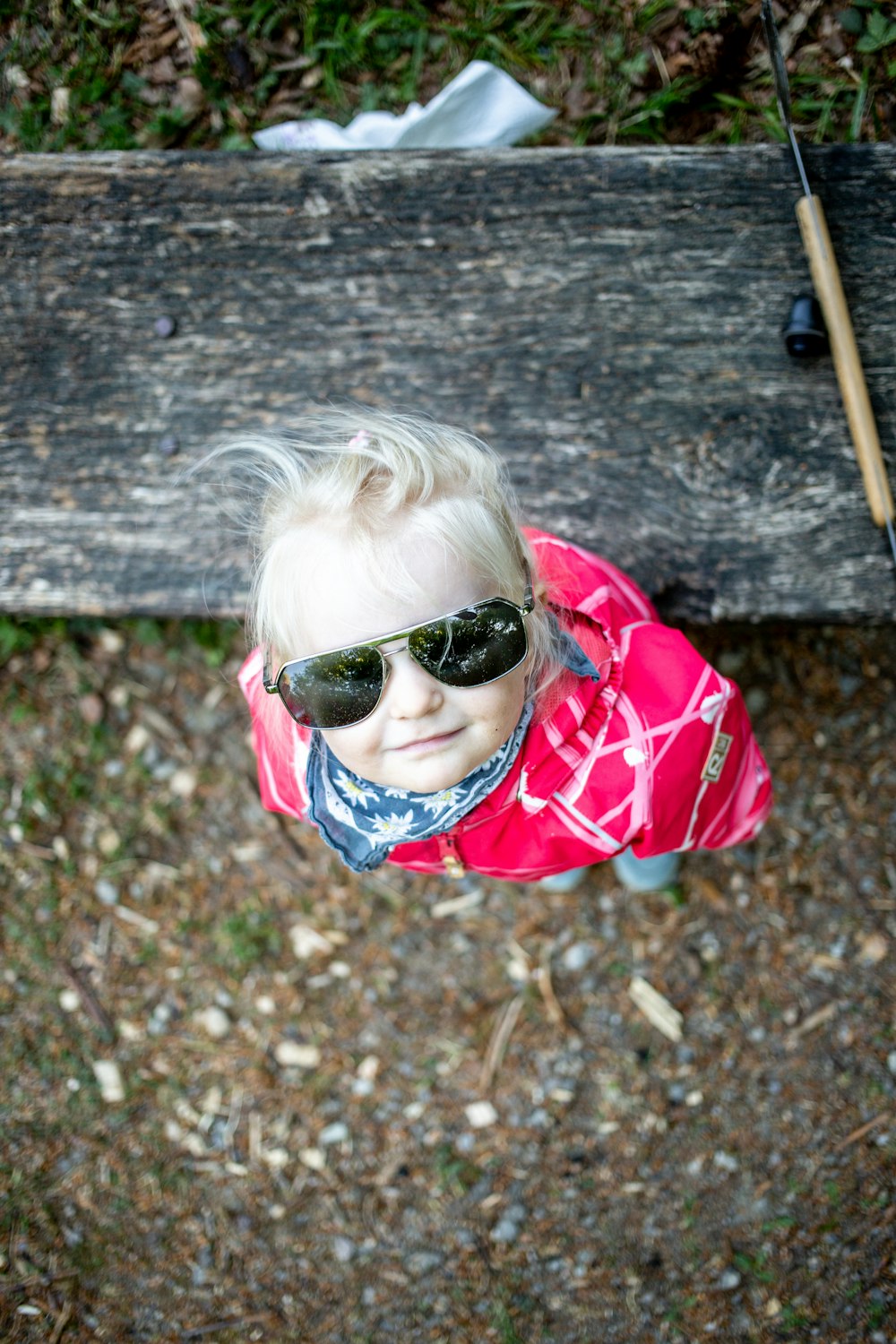 girl in red and white plaid shirt wearing black sunglasses