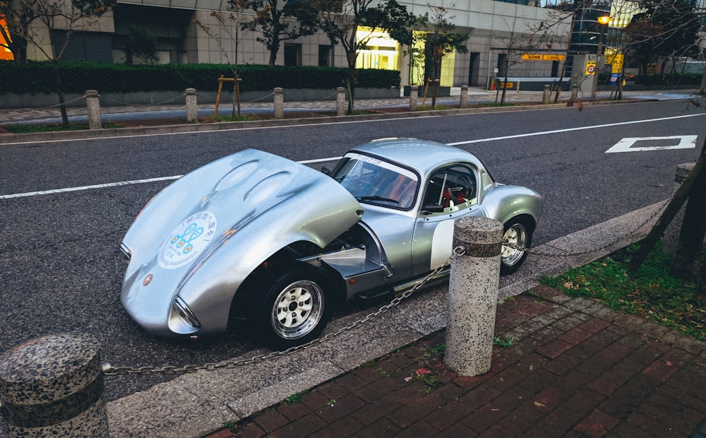 white volkswagen beetle parked on roadside during daytime