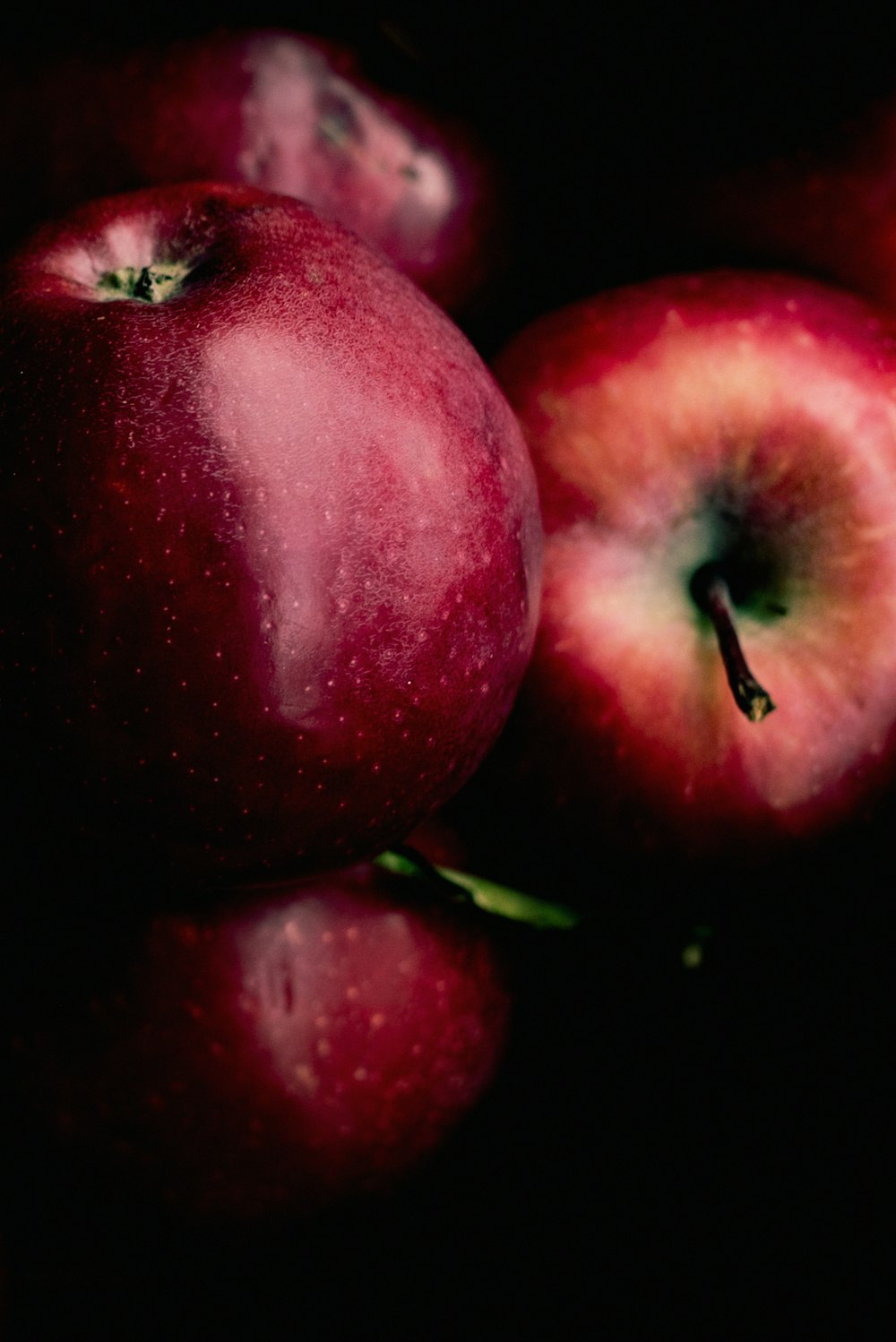 red apples in black background