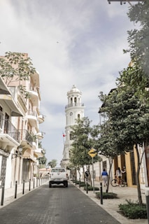 white concrete building near green trees during daytime