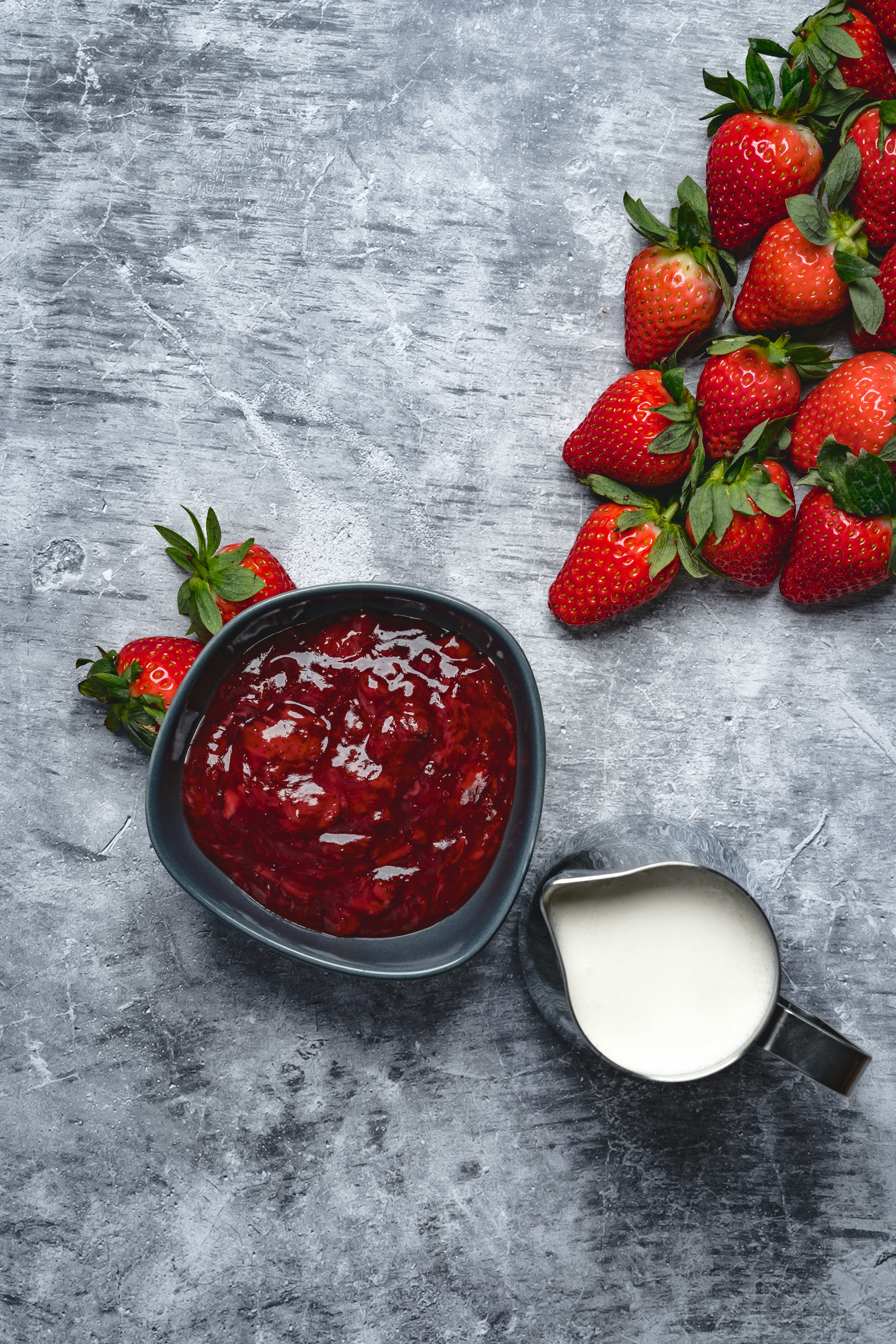 strawberries in stainless steel bowl