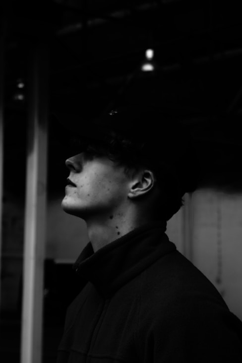grayscale photo of woman wearing black hat