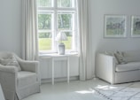 A freshly painted living room with soft, warm tones and crisp white trim.