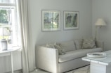 Freshly painted cozy living room walls in soft gray tones with white trim
