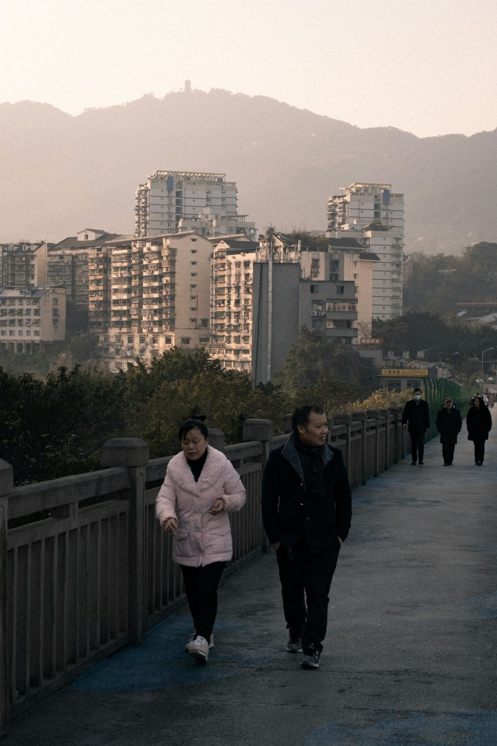 man and woman standing on gray concrete floor during daytime