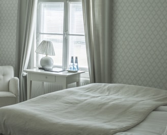 white table lamp on white wooden table