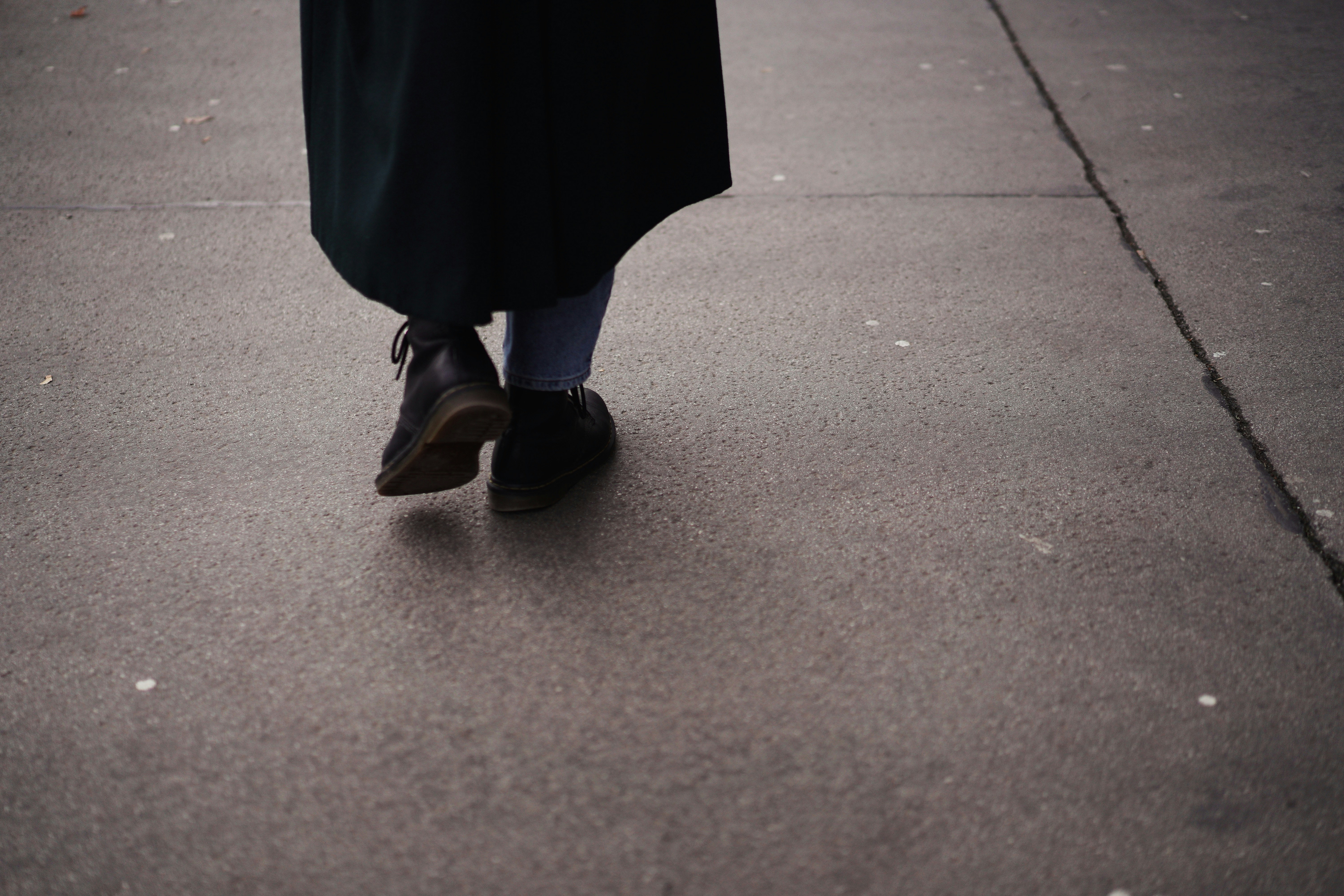 woman in black dress and black leather flats