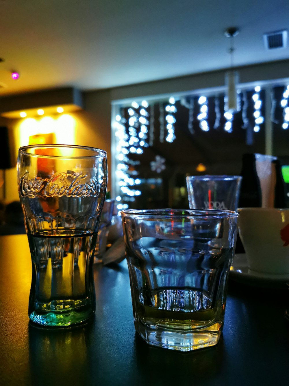 clear drinking glass with yellow liquid inside