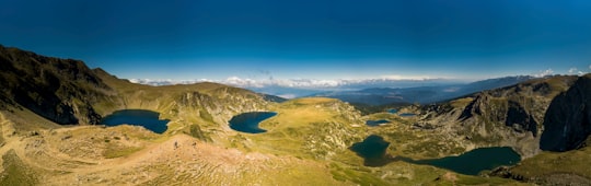 aerial view of green and brown field during daytime in Rila Bulgaria