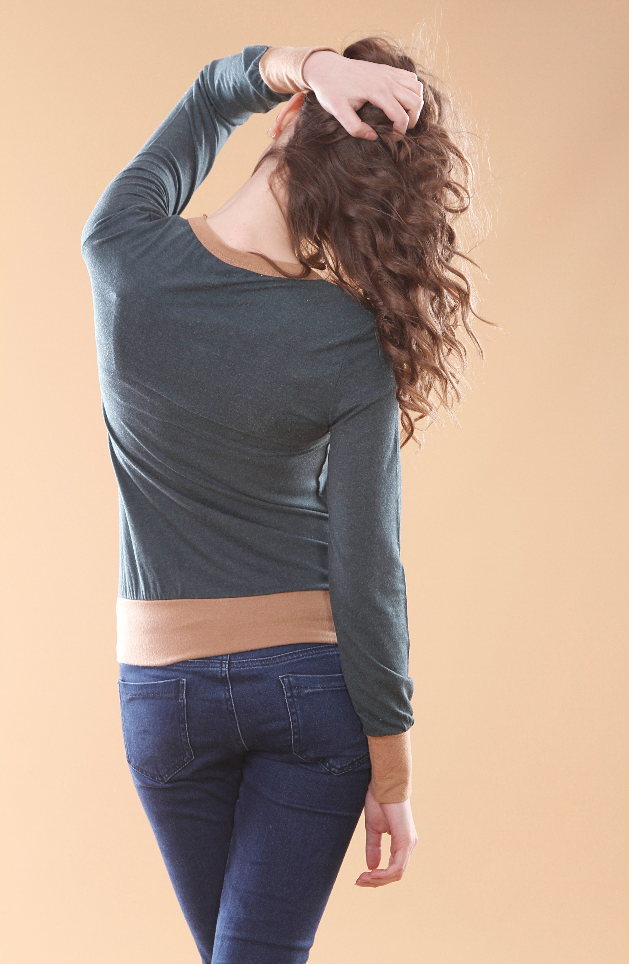 woman in black long sleeve shirt and blue denim jeans