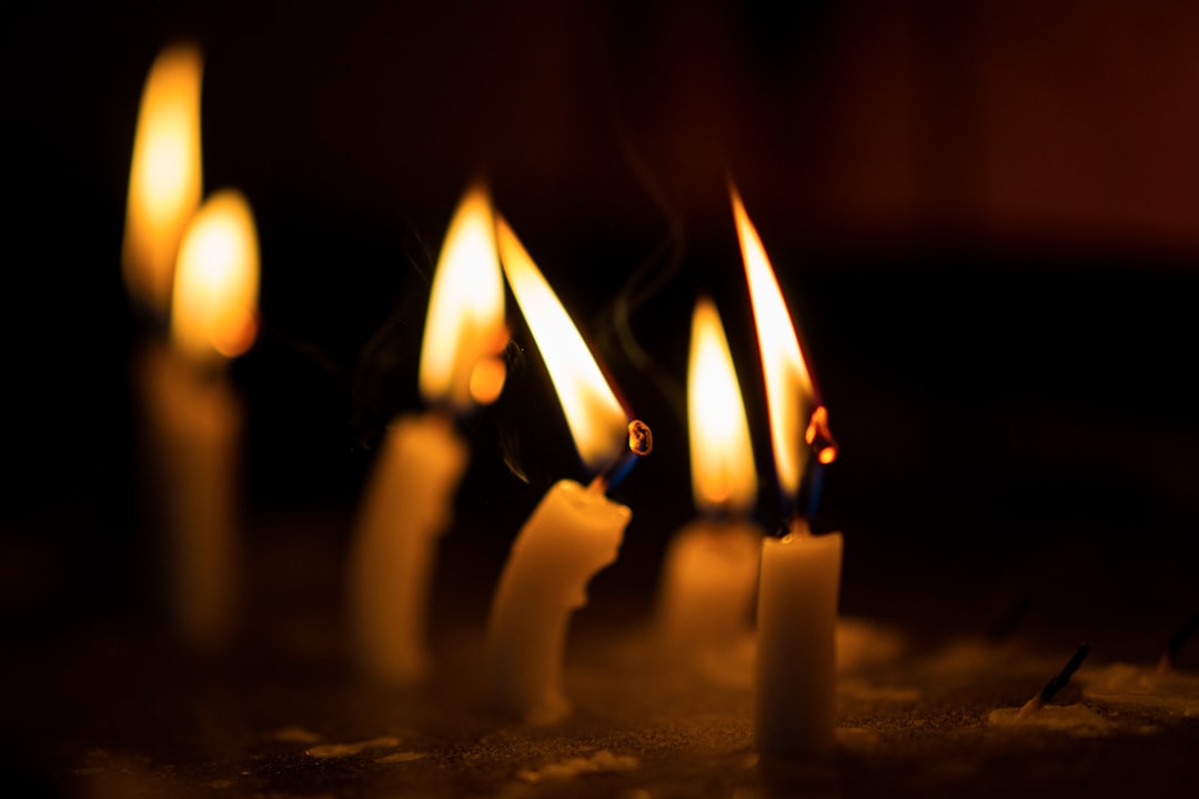 lighted candles on black surface