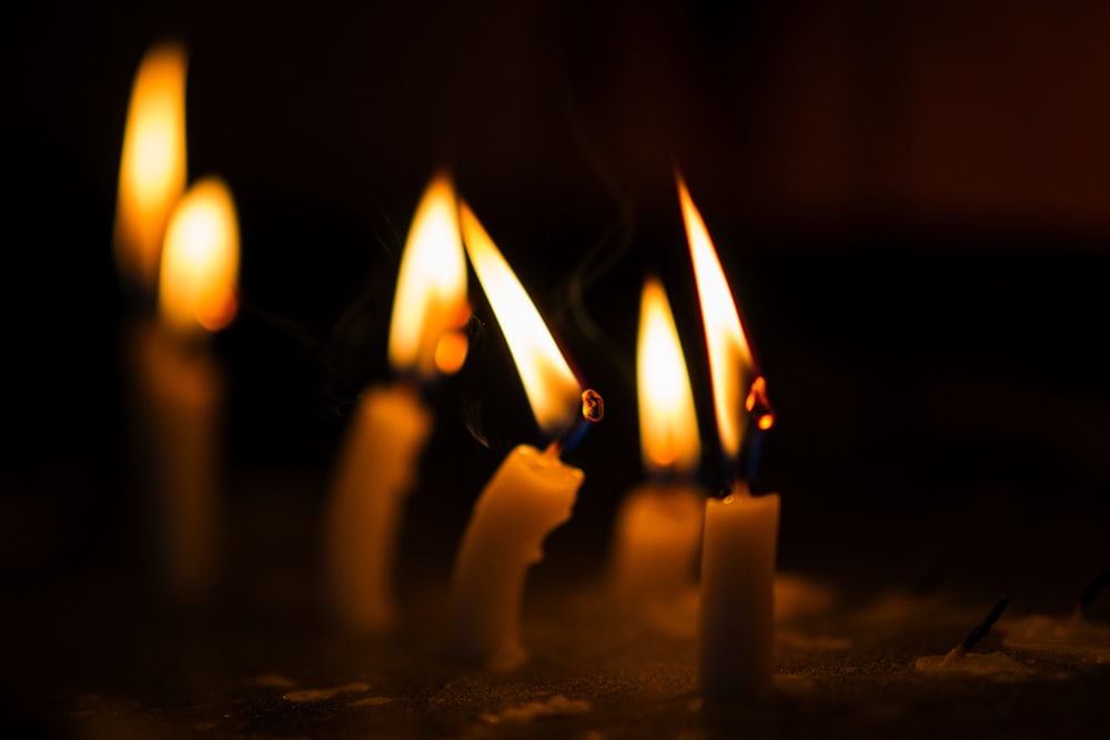 lighted candles on black surface