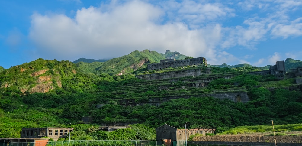 green mountain under cloudy sky during daytime