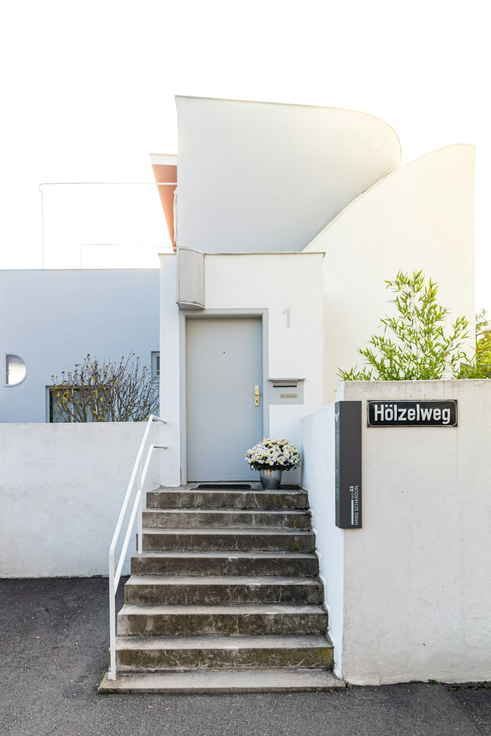 white concrete building with staircase