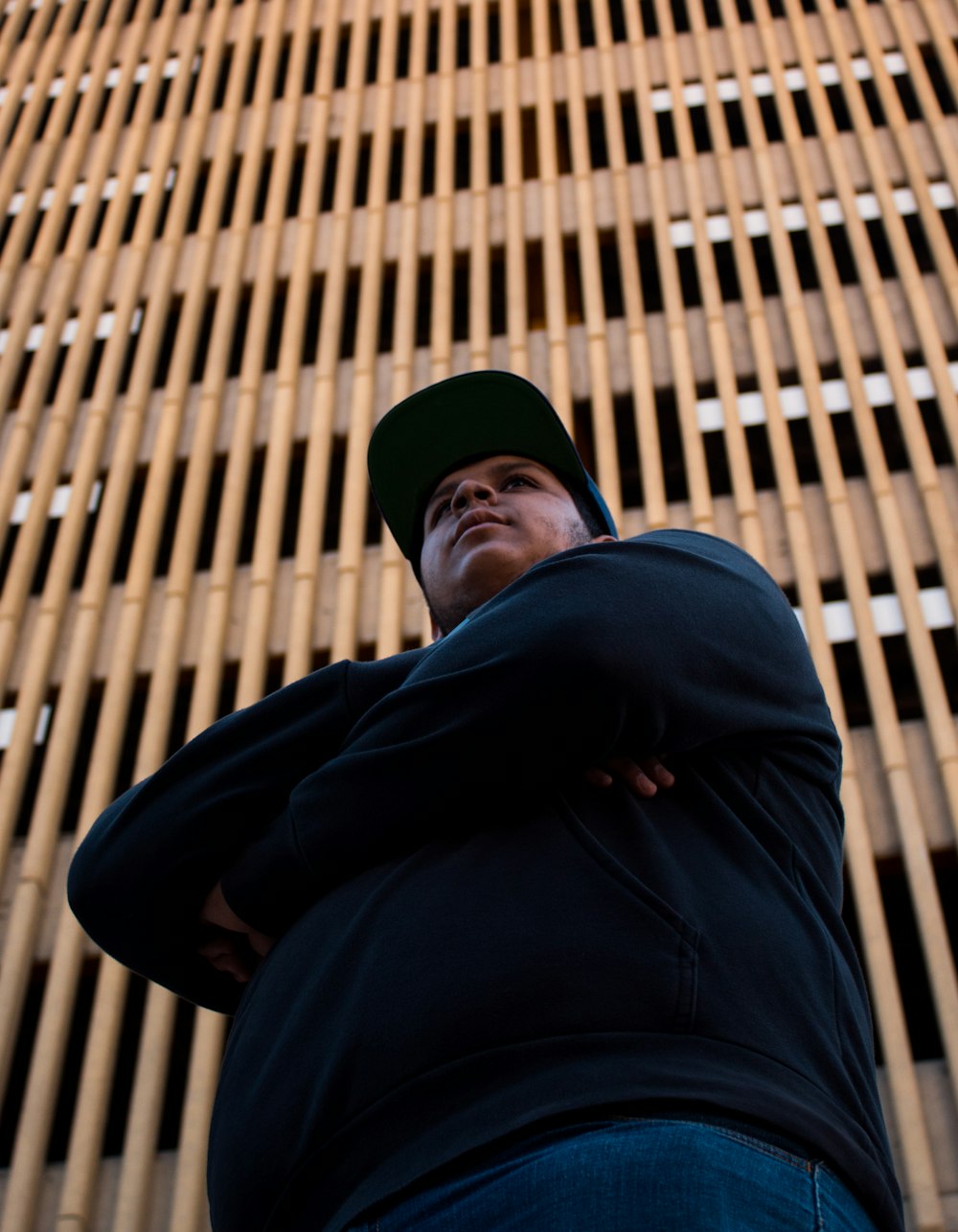 man in black hoodie and black knit cap