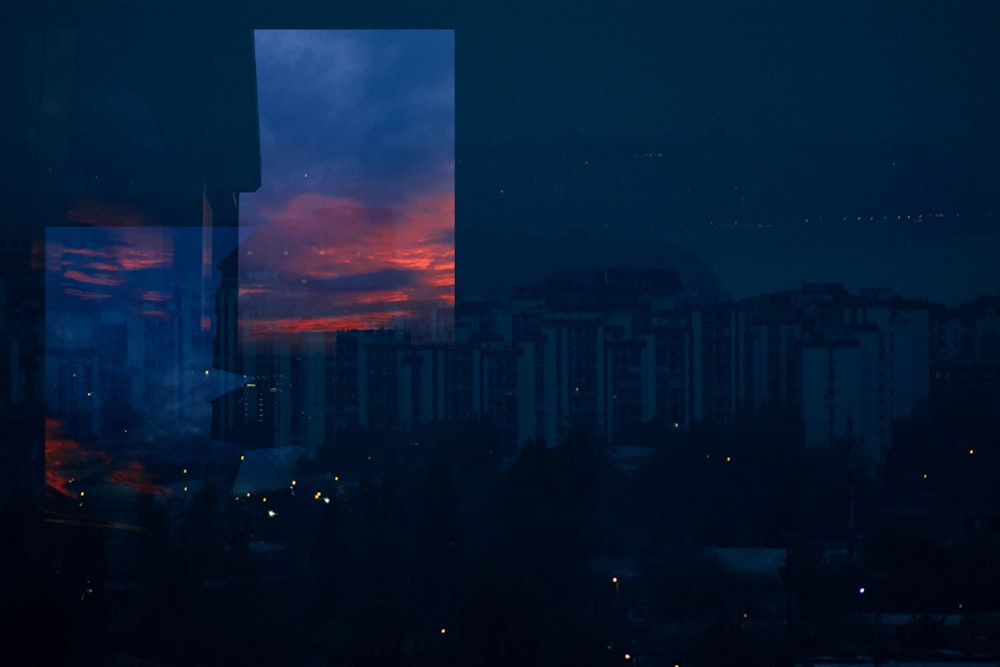 city skyline under orange and blue sky