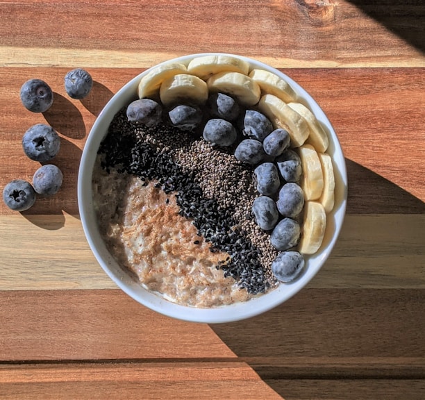 brown and black beans in white ceramic bowl