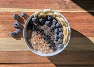 brown and black beans in white ceramic bowl