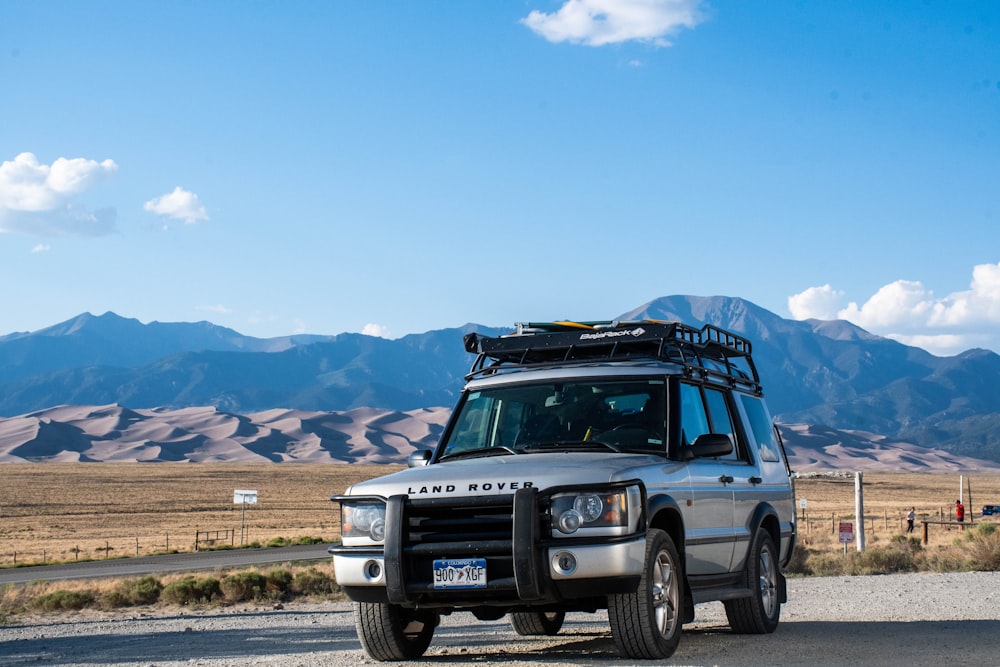 black jeep wrangler on dirt road during daytime