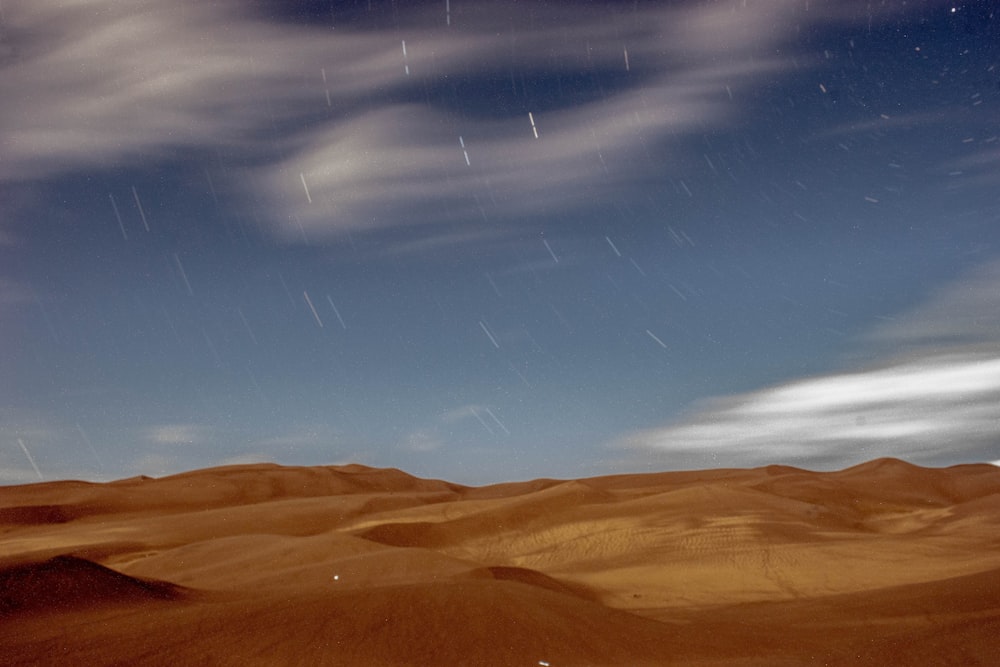 brown sand under blue sky during daytime