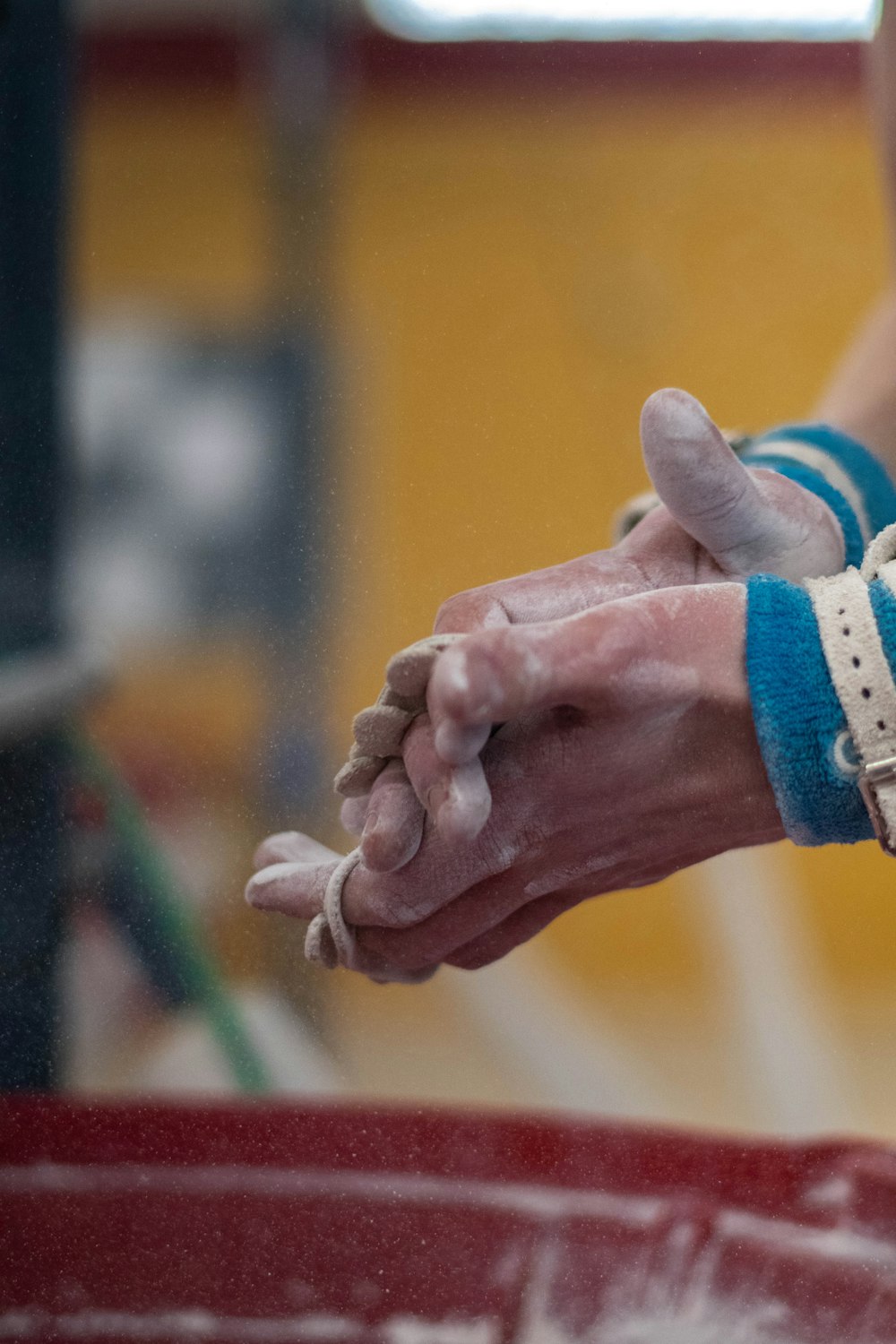 person wearing white and blue bracelet