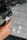 Close-up of a memory card being inserted into a camera with a blurred background