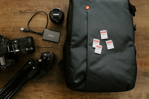 black laptop bag on brown wooden table