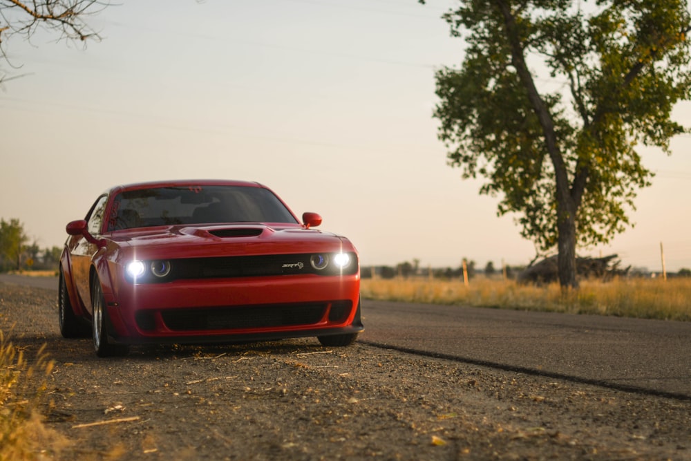 red car on road during daytime