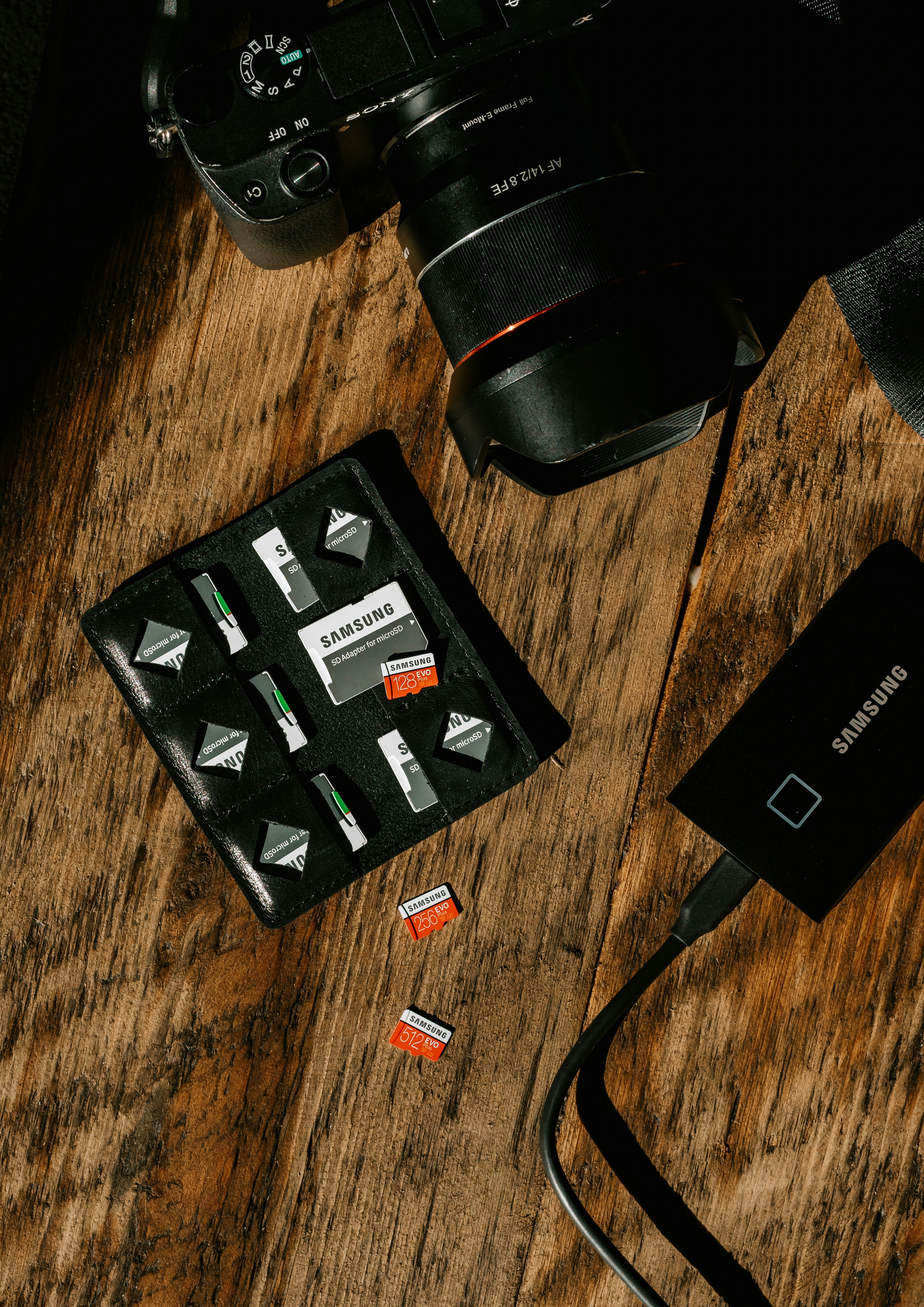 black rectangular device on brown wooden table
