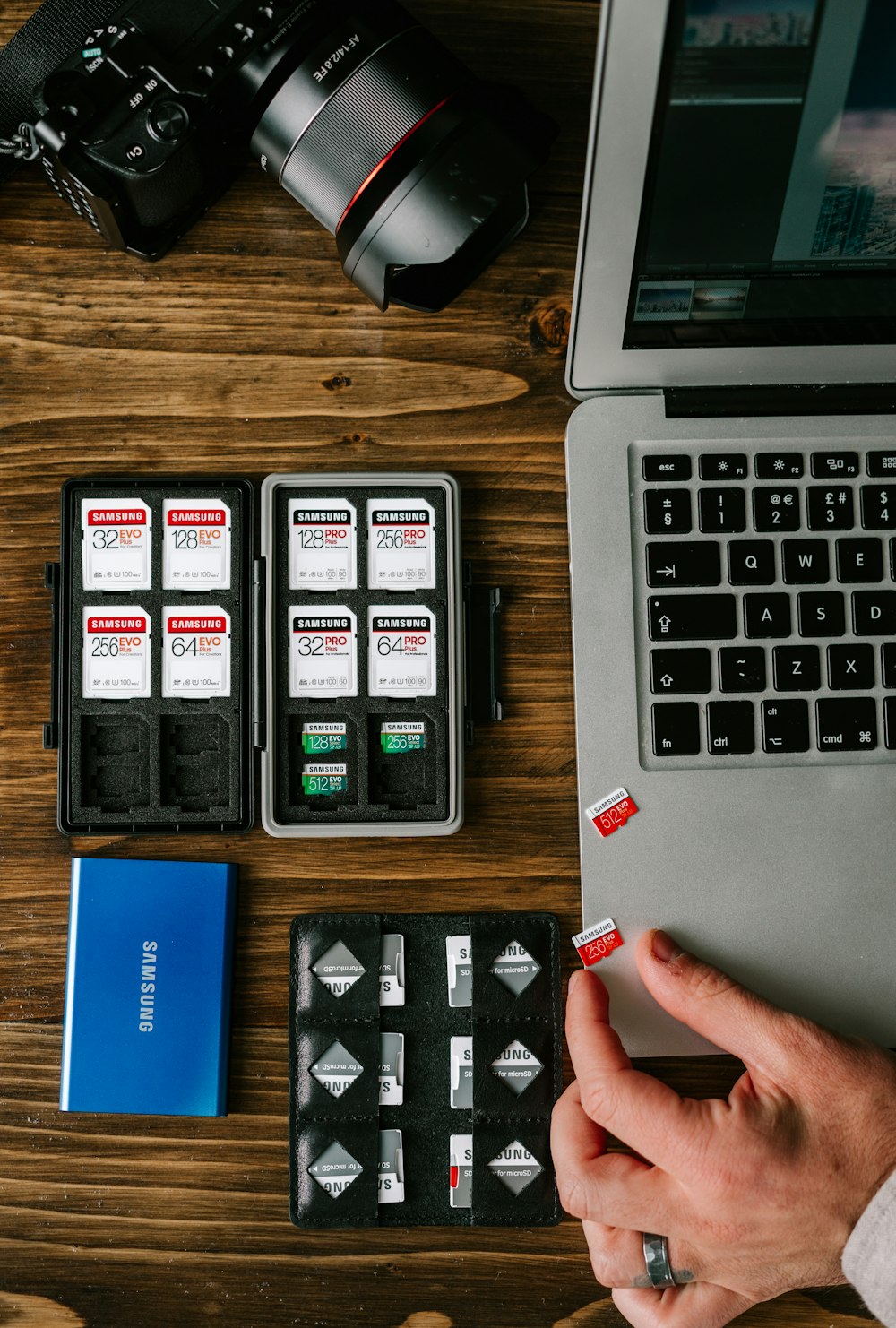 person holding black and white plastic medicine organizer