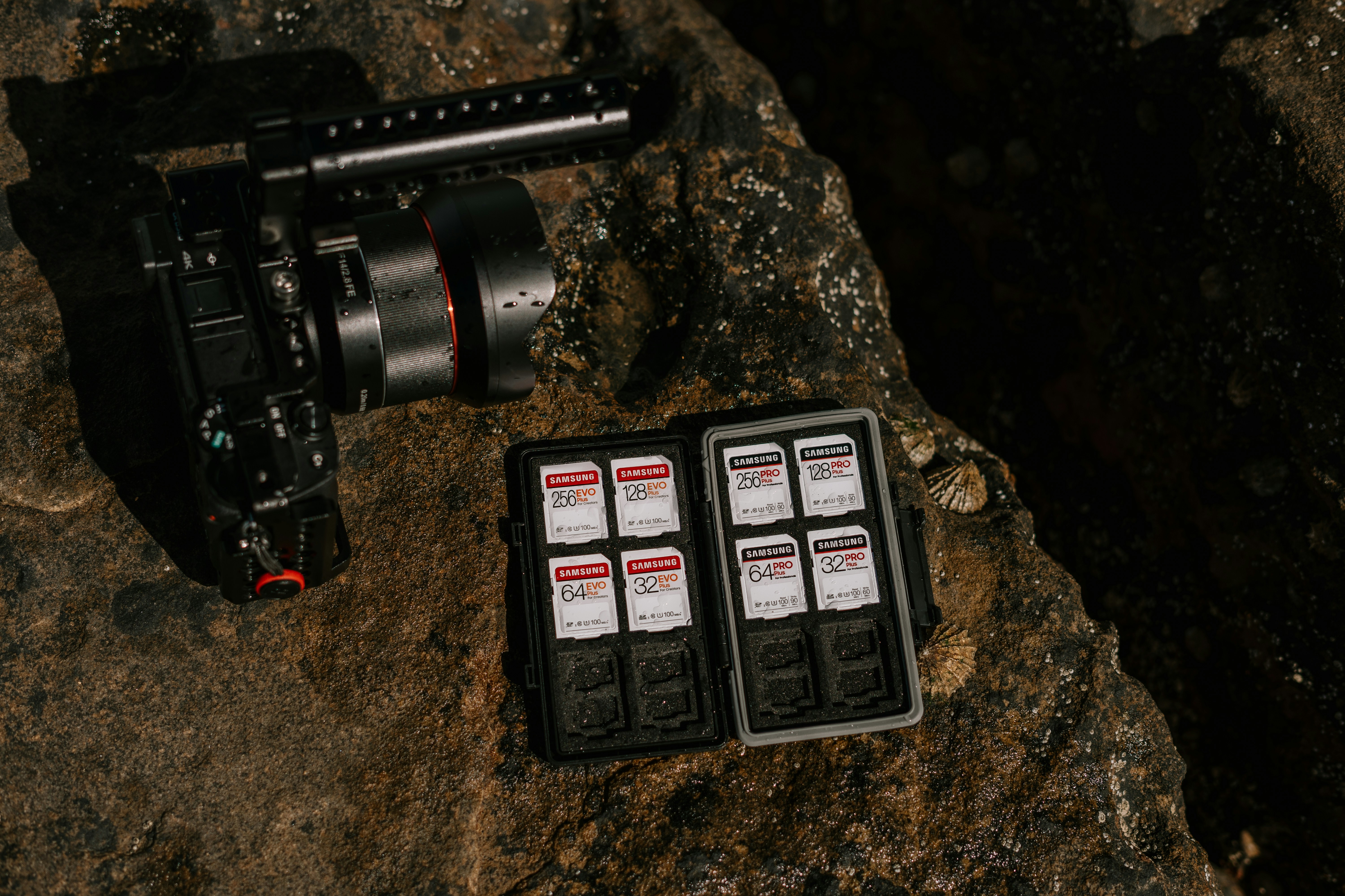 black and silver camera on brown and black surface