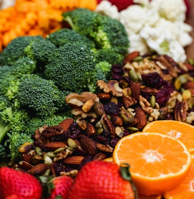 sliced orange fruit and green broccoli