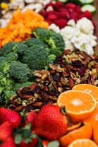 sliced orange fruit and green broccoli