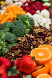 sliced orange fruit and green broccoli