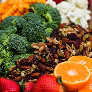 sliced orange fruit and green broccoli