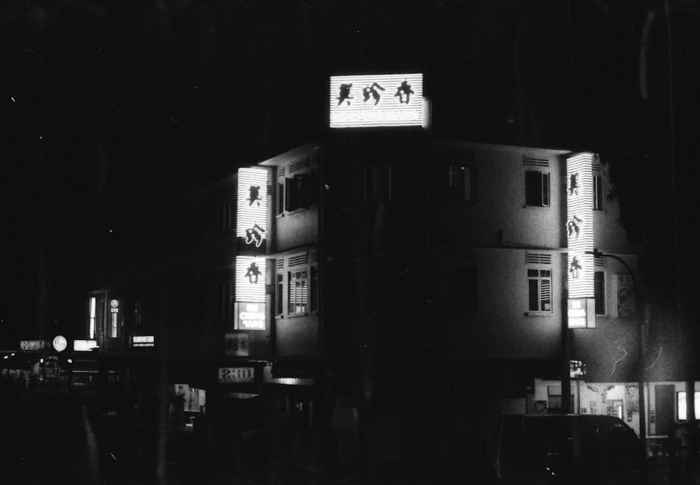 grayscale photo of building during night time