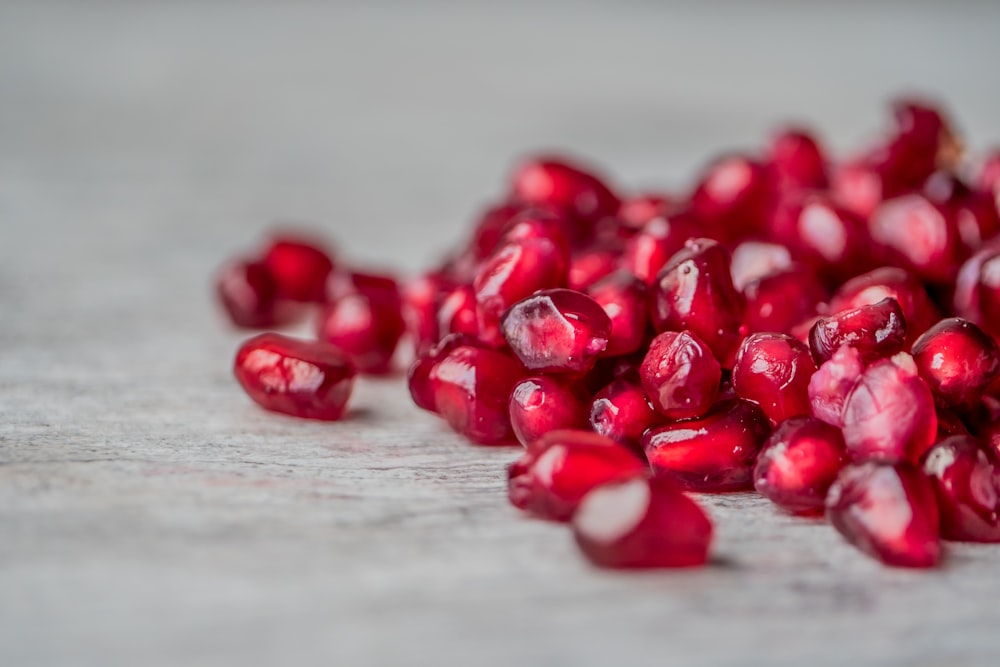 red round fruits on white textile