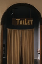 brown curtain near brown wooden door