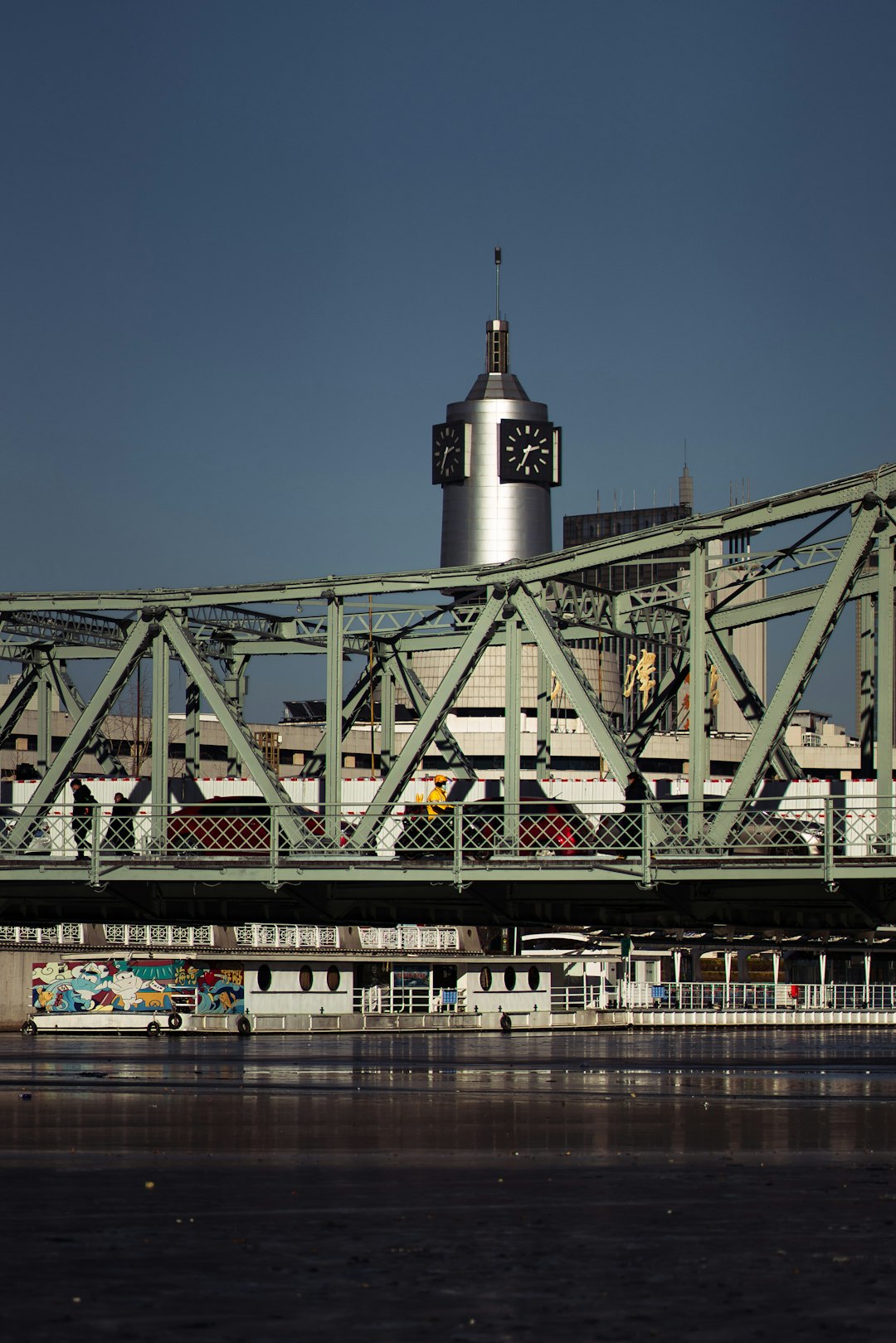 gray metal bridge under blue sky during daytime