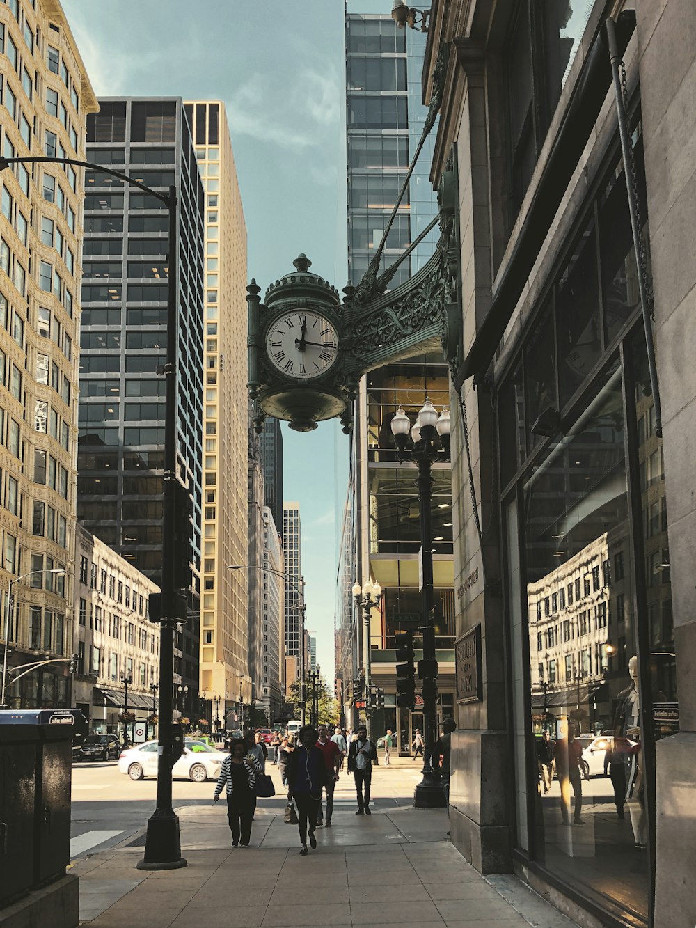 people walking on street near high rise buildings during daytime