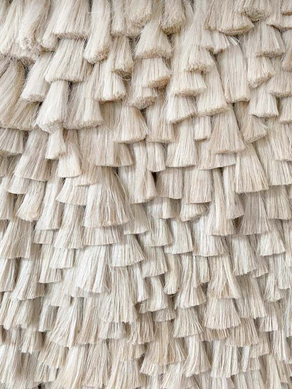 Artisan hand-stitching textile