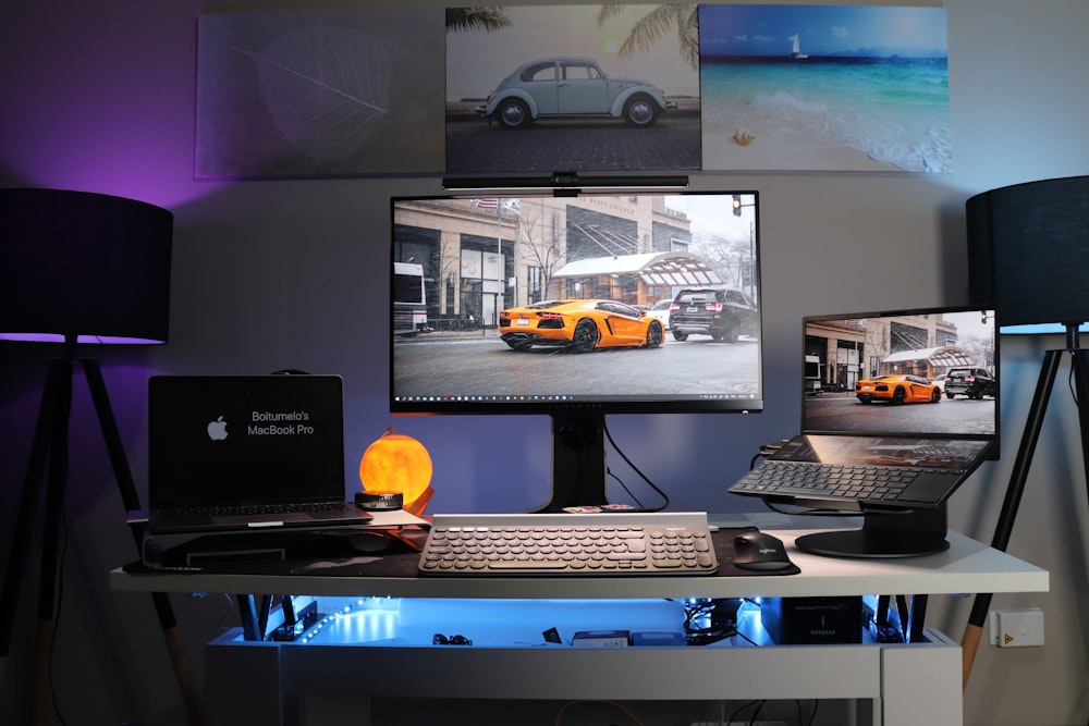 black laptop computer on white desk