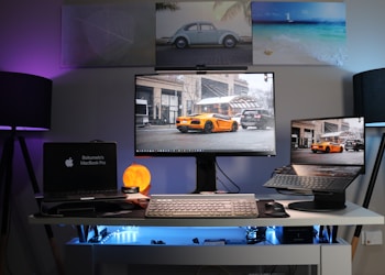 black laptop computer on white desk