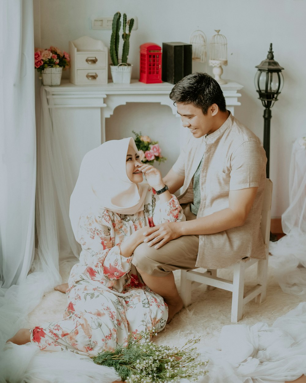 woman in white dress sitting on white wooden chair