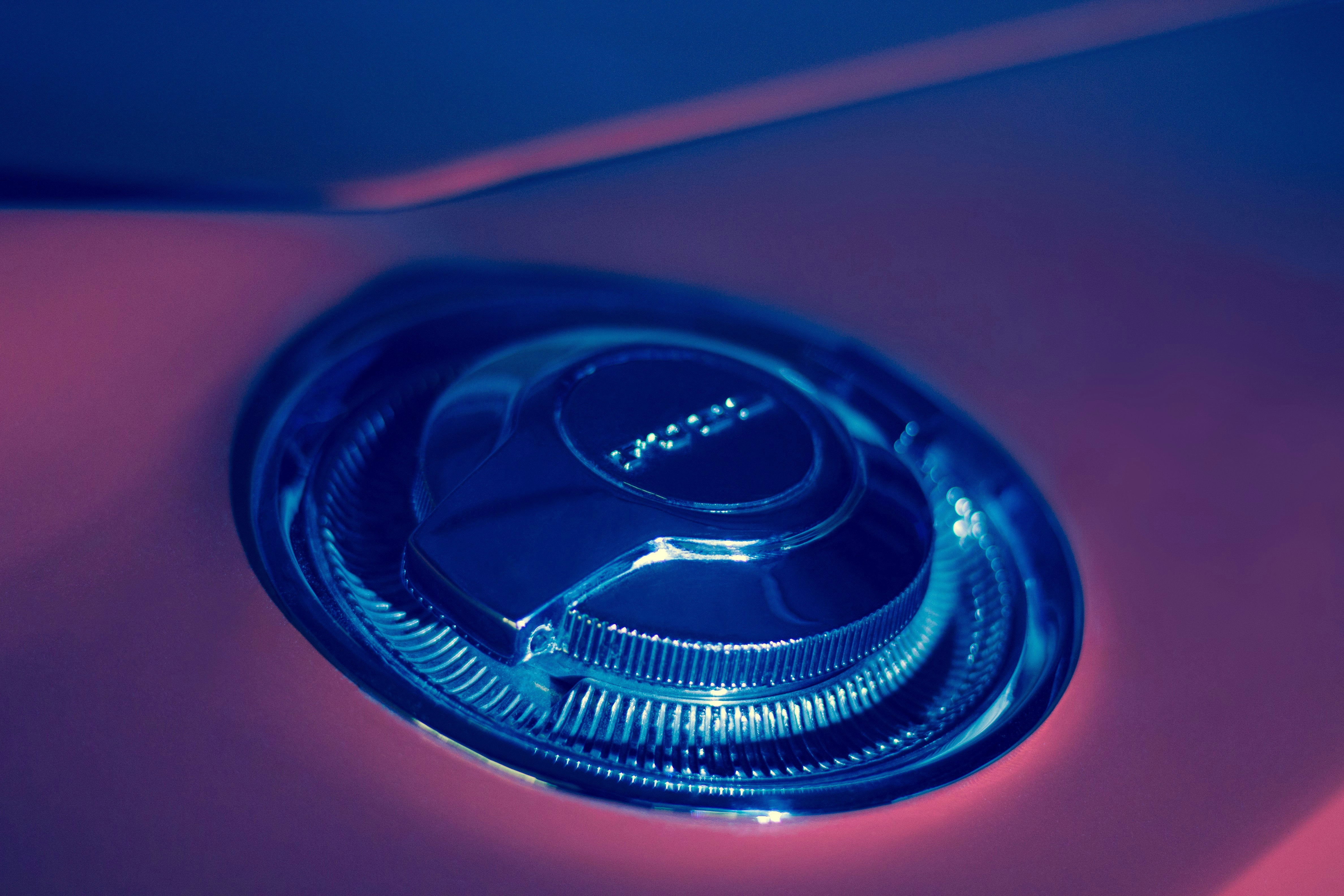 A Mazda CX-90 plug-in hybrid charging on a Level 2 home EV charger in a suburban driveway