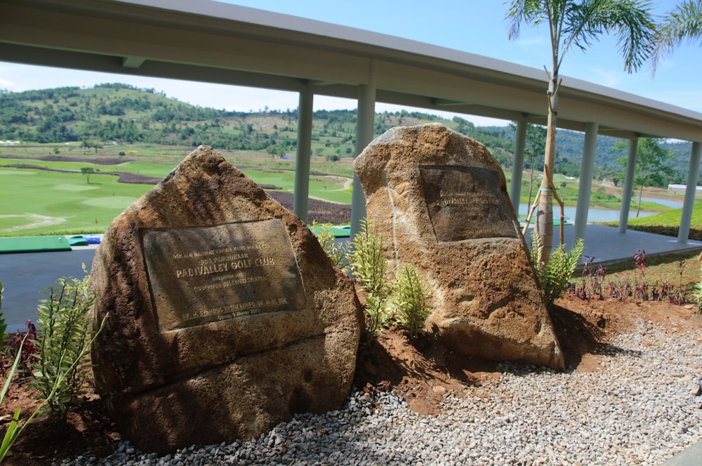 a couple of large rocks sitting next to each other