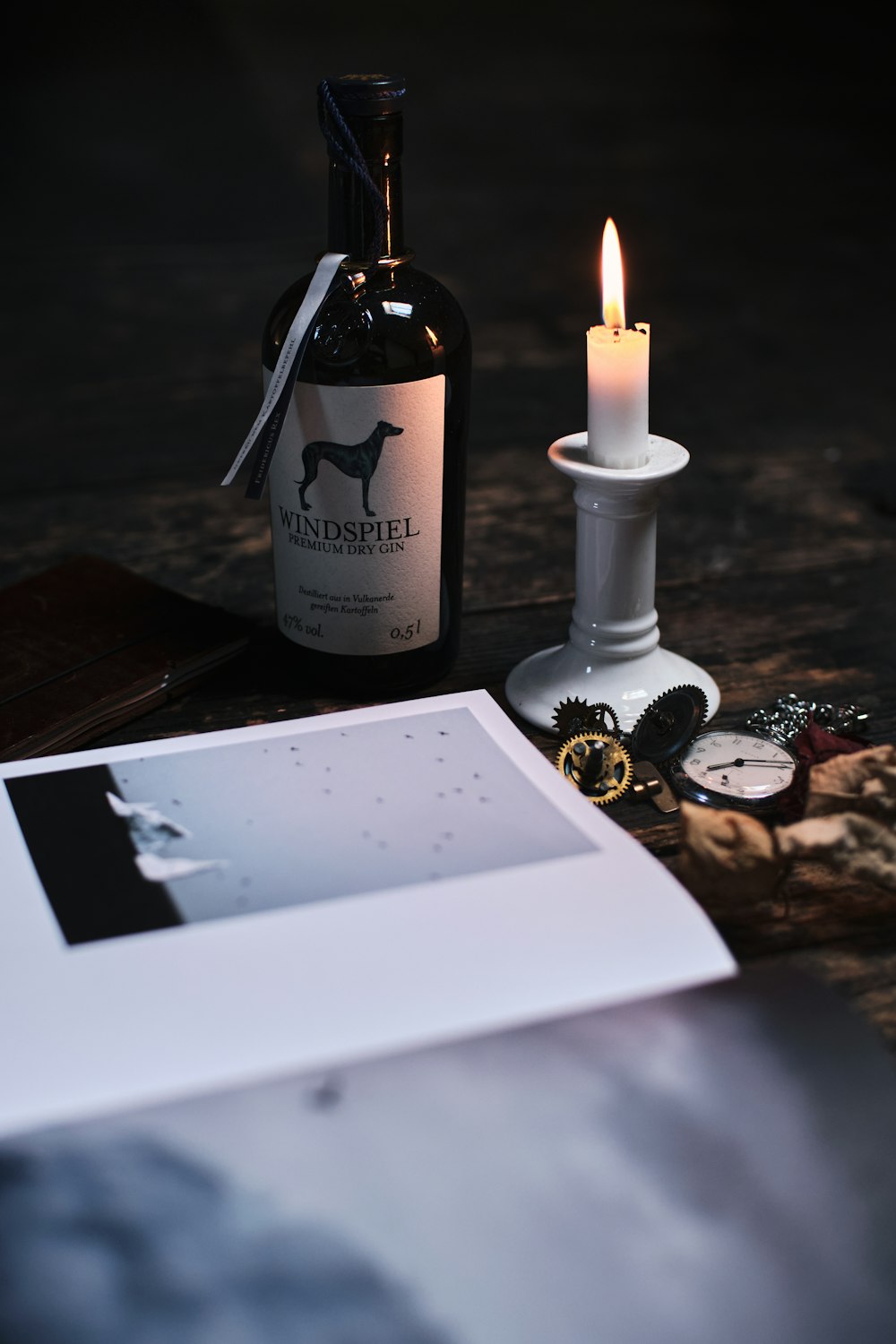 white candle on black wooden table