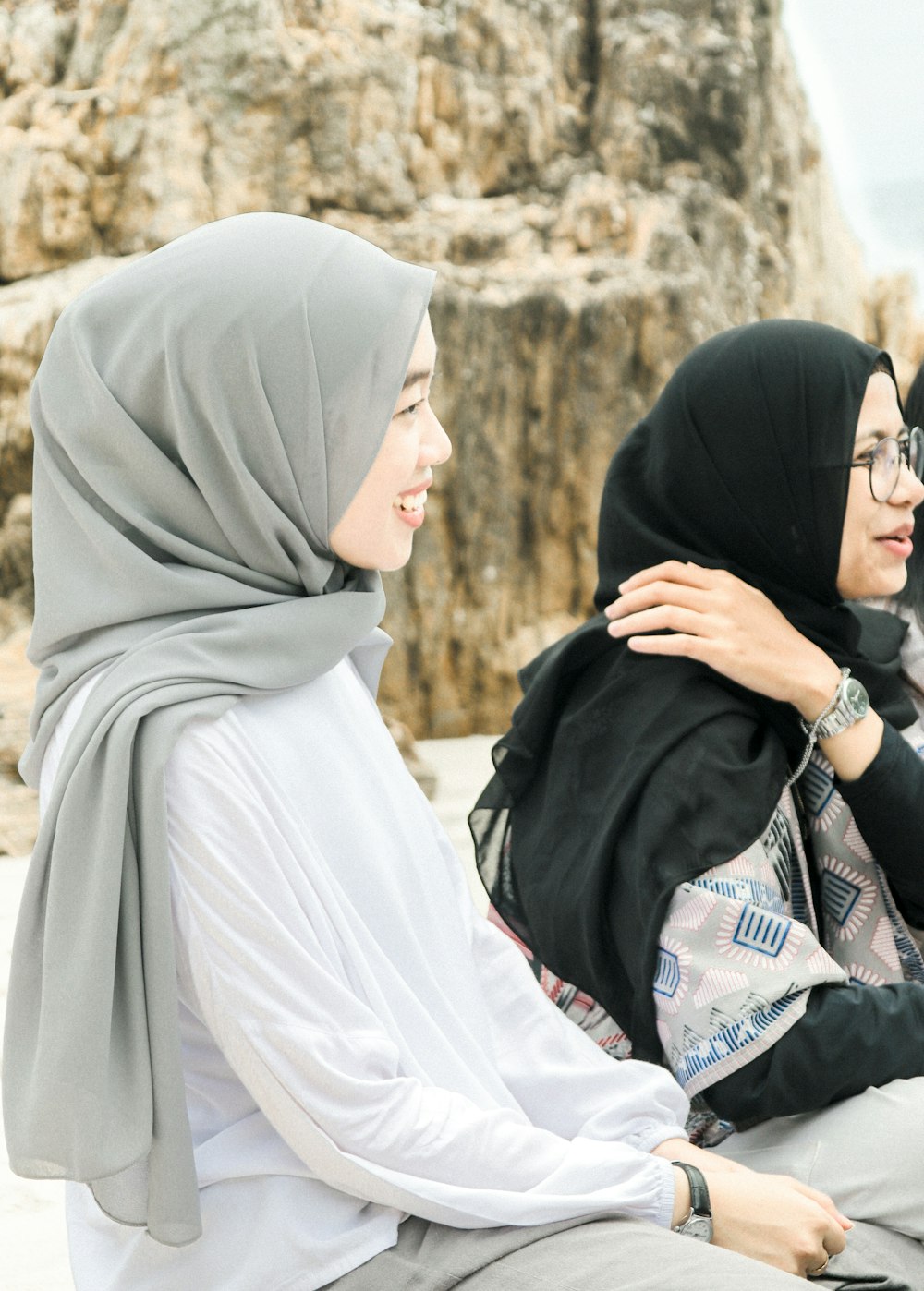 woman in white hijab and black abaya