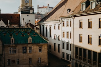 A European city skyline with green rooftops symbolizing sustainable urban development partnerships.