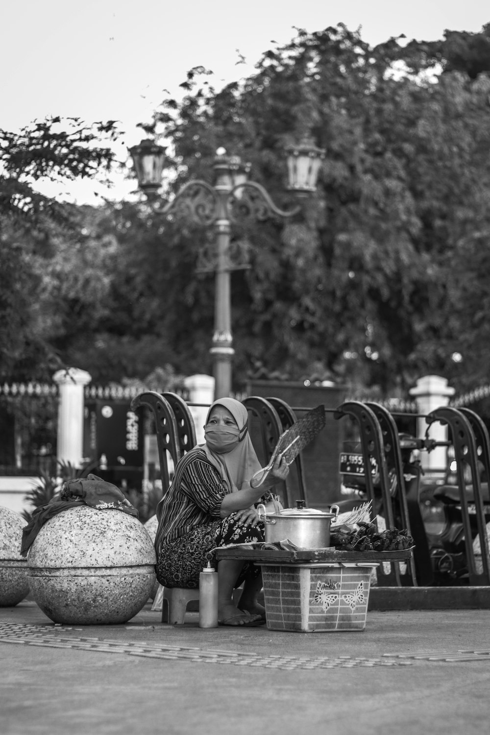 grayscale photo of woman sitting on chair